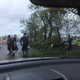 Young men help clear branches off the street near where Ruth Santiago lives. Photo Courtesy of Ruth Santiago